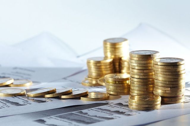 Business diagram on financial report with coins