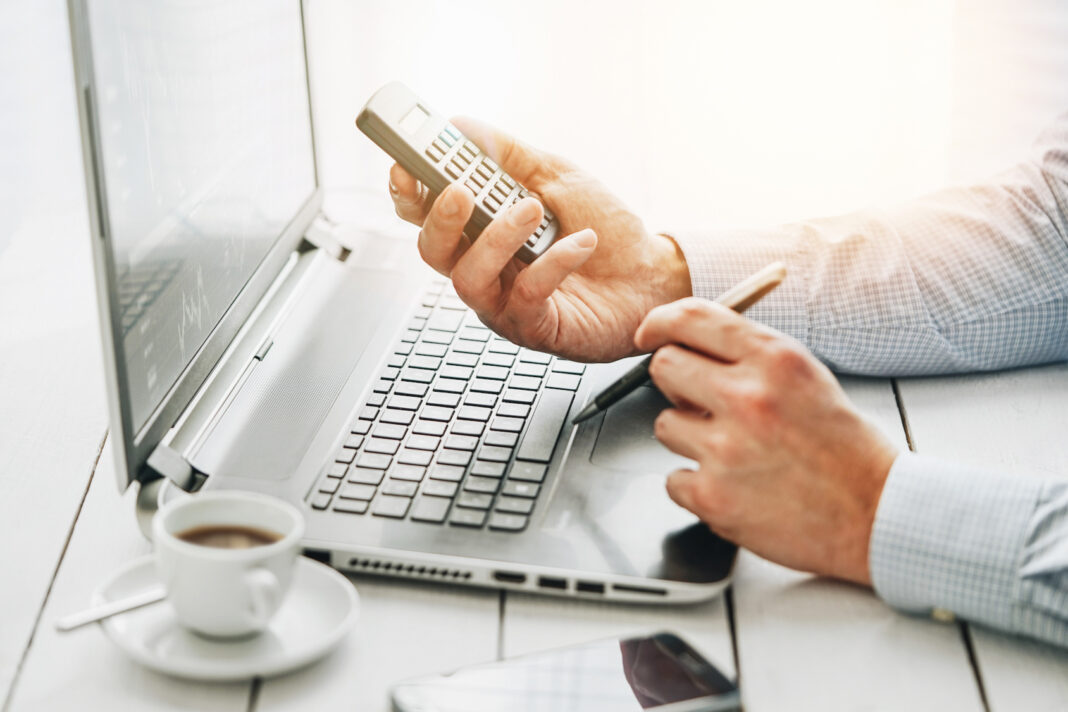 businessman using a calculator